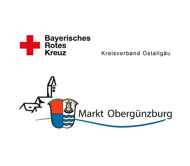 Logo des Bayerischen Roten Kreuzes mit einem roten Kreuz und dem Schriftzug "Kreisverband Ostallgäu". Daneben befindet sich das Wappen von Markt Obergünzburg, das eine stilisierte Darstellung des Marktnamens zeigt.