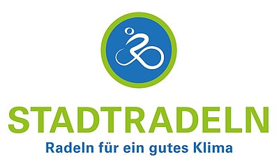 Logo der Aktion „Stadtradeln“. Darunter steht „Radeln für ein gutes Klima“. Ein Fahrradsymbol ist im oberen Bereich des Logos in einem blauen Kreis zu sehen.