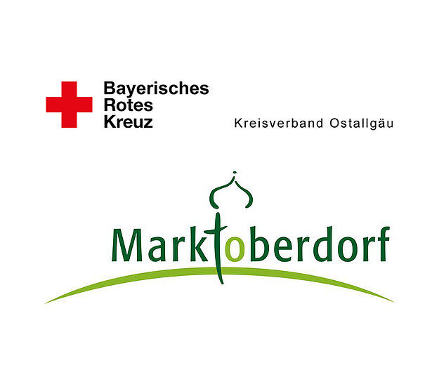 Logo des Bayerischen Roten Kreuzes mit dem Schriftzug "Kreisverband Ostallgäu" und dem Namen "Marktoberdorf" in grüner Schrift.