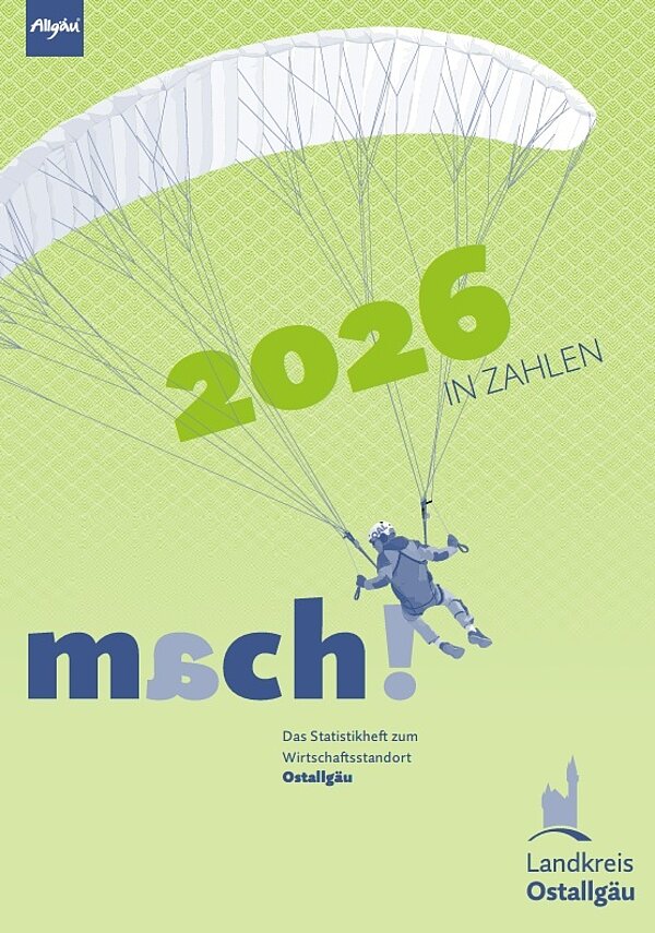 Ein Cover des Statistikhefts für den Wirtschaftsstandort Ostallgäu mit der Jahreszahl "2026" in großen, grünen Zahlen. Darunter steht "msch!" in blauen Buchstaben. Im Hintergrund ist ein Paragleiter dargestellt, der in die Luft fliegt, vor einem hellgrünen Muster.