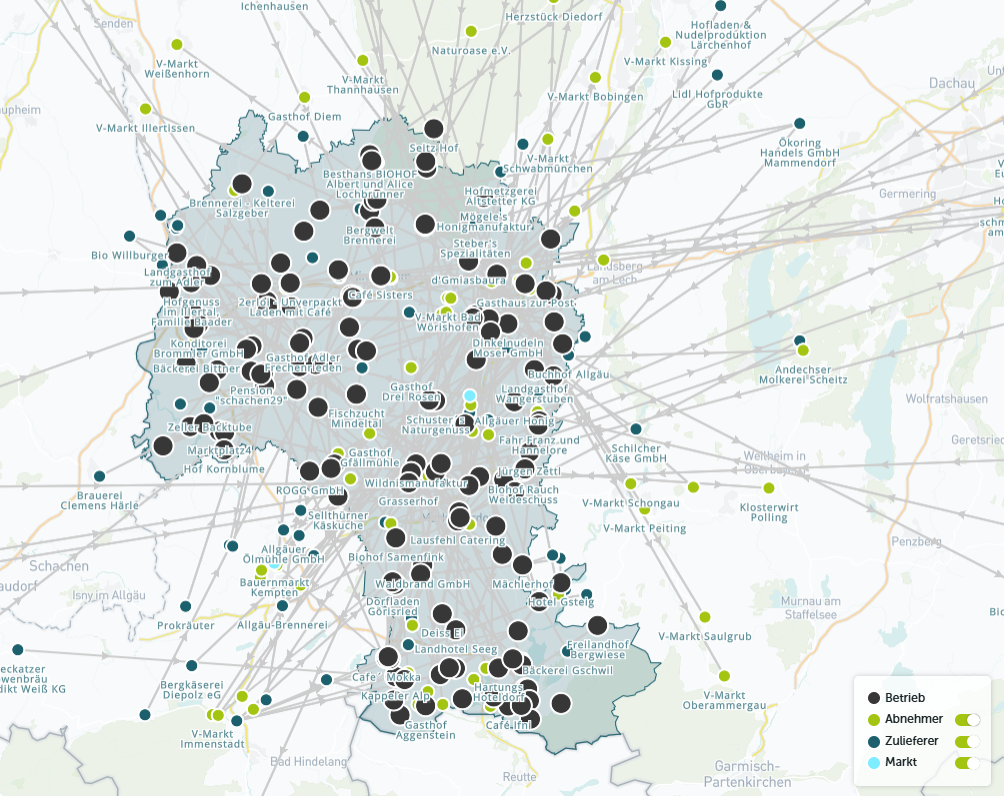 Eine Karte von Baden-Württemberg mit zahlreichen Punkten, die verschiedene Betriebe, Zulieferer und Märkte darstellen. Die Punkte sind in verschiedenen Farben markiert, wobei grüne Punkte für Märkte, hellgrüne für Zulieferer und schwarze für Betriebe stehen. Linien verbinden die Punkte miteinander.